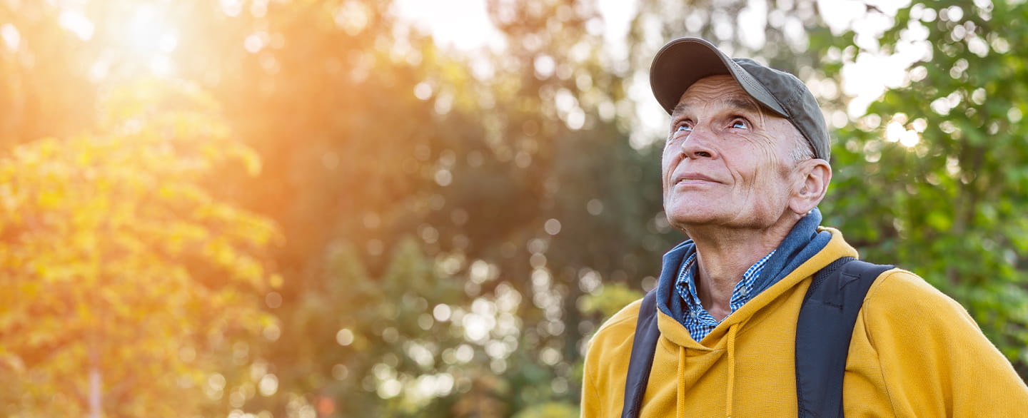Older man outside hiking