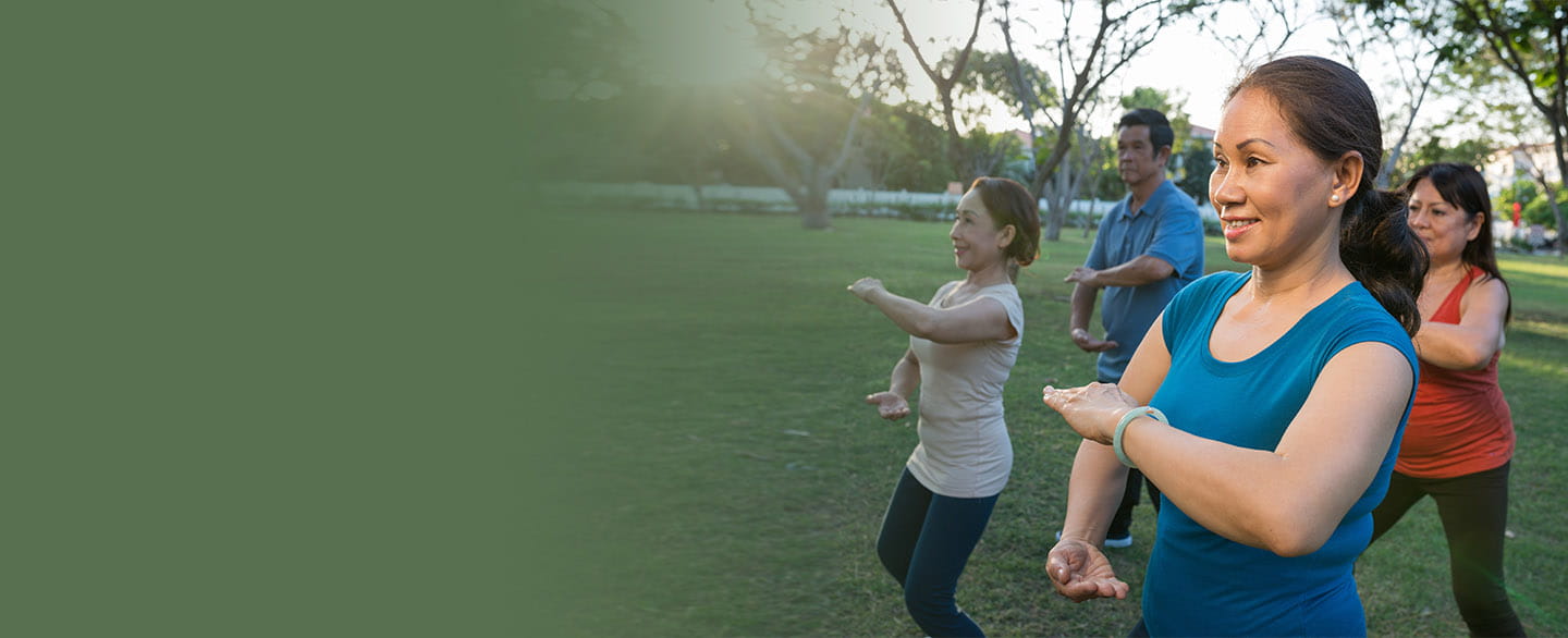 Group of people doing tai chi.