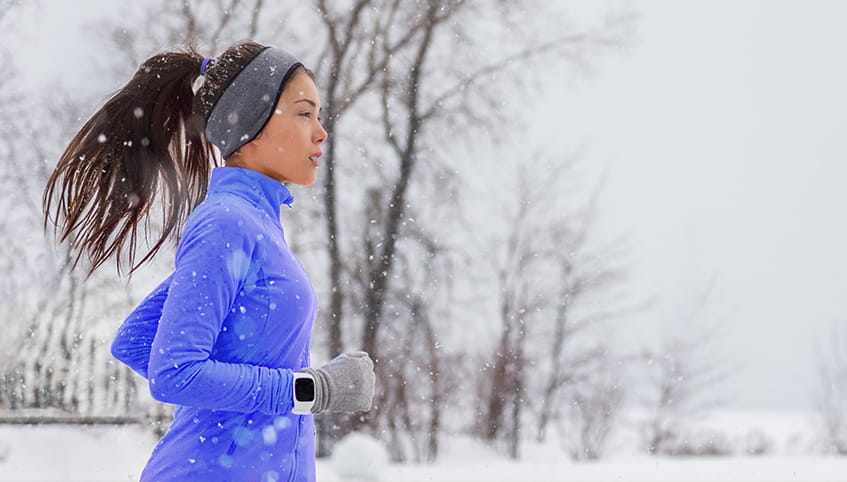 Woman running in winter time